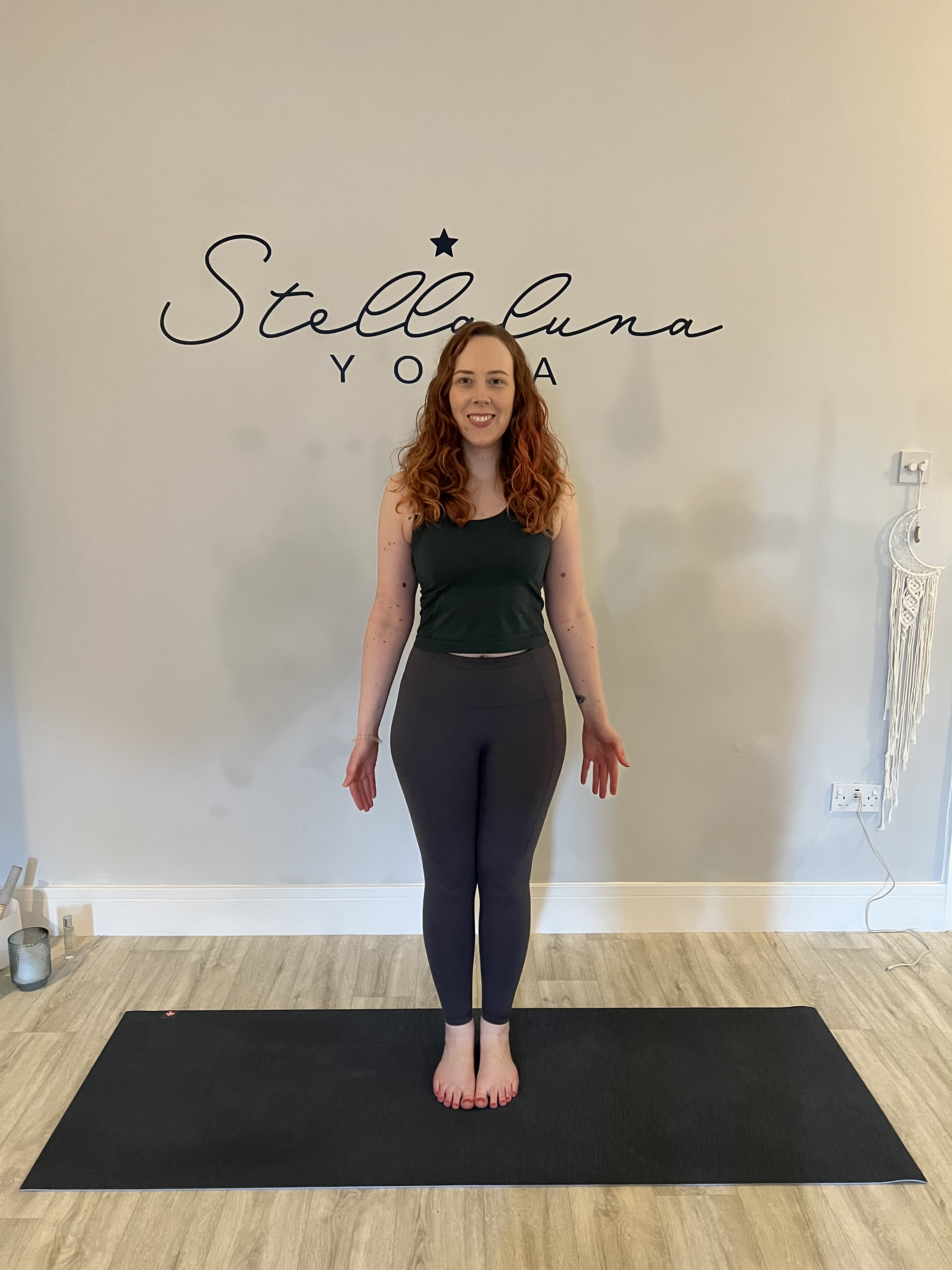 Kerry standing in tadasana at Stellaluna Yoga
